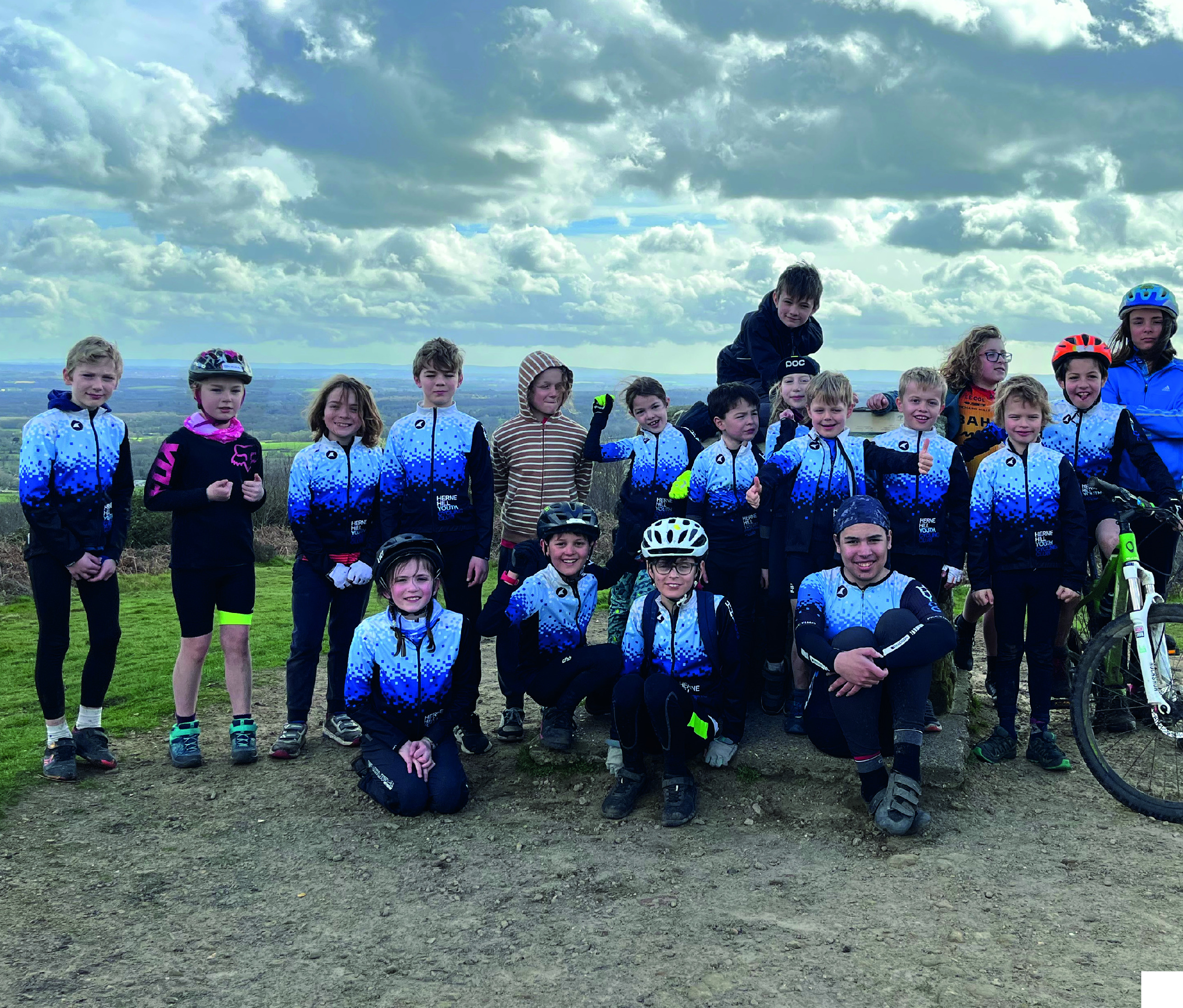 HHYCC riders gathered on a hilltop ride